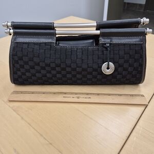 The Sak Black Woven Clutch with Silver Accents